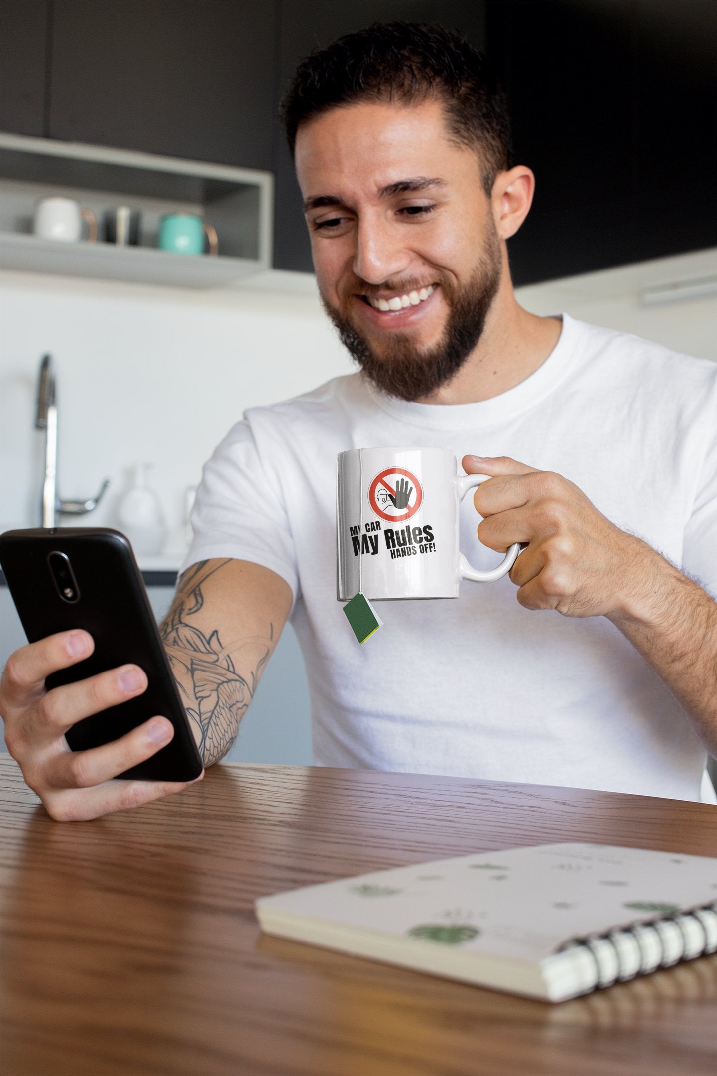 young man drinking out of a jdm mug