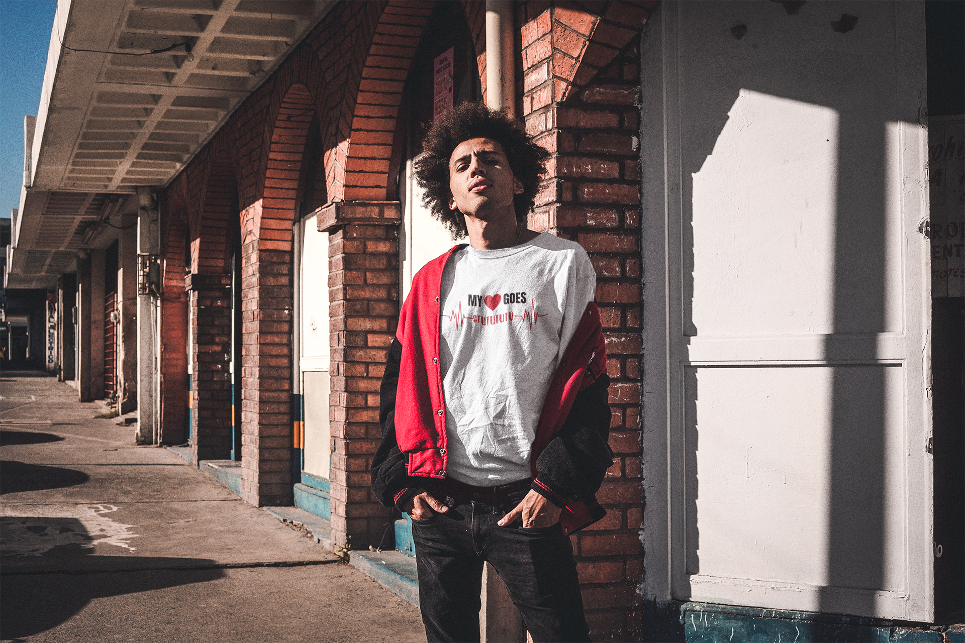 young man with a afro wearing a turbo t-shirt