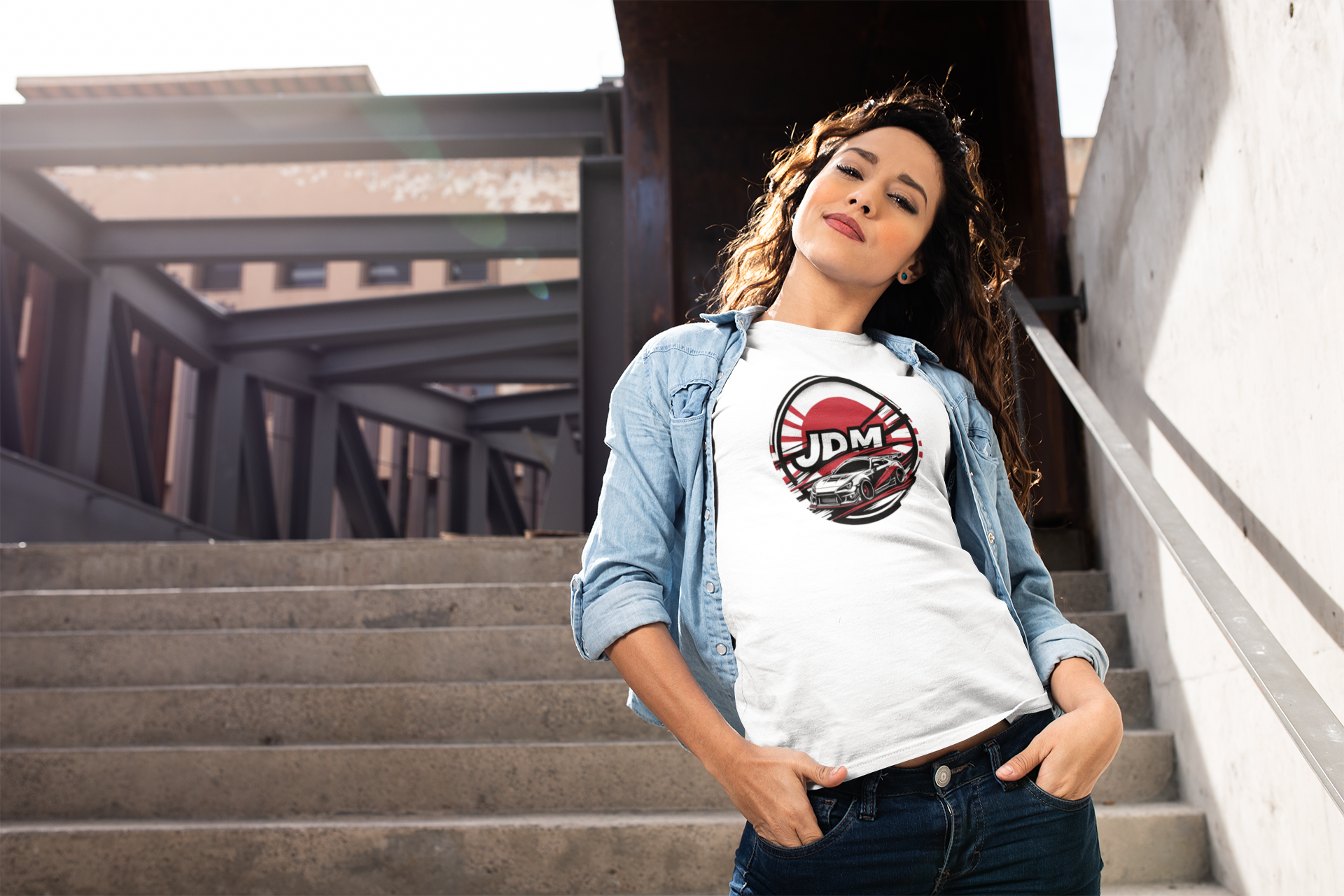 woman with curly hair wearing a jdm t-shirt